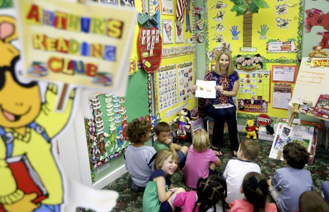 C.K. Carter reads her second book, My Silly Dog Gus,  to students at the Little Place pre-school in Wellington on Oct. 8, 2014. (Bill Ingram / Palm Beach Post)